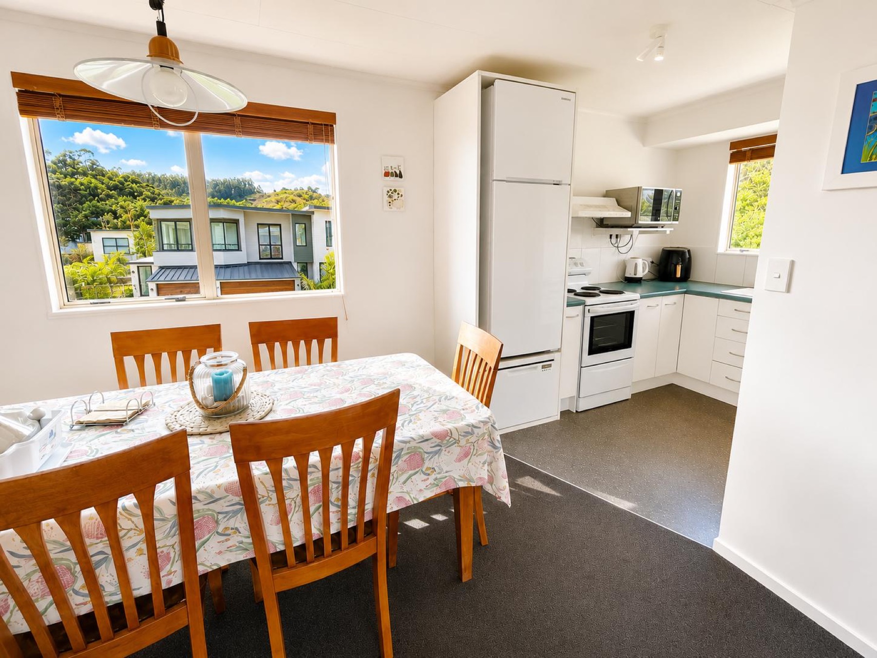 Dining area beside the bright kitchen