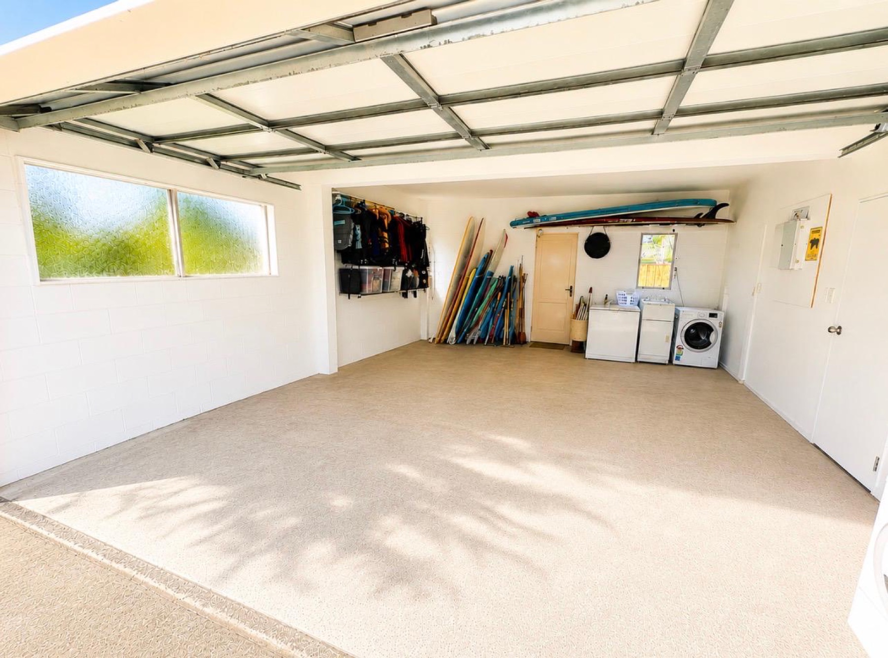 Large double garage with laundry and storage for water gear
