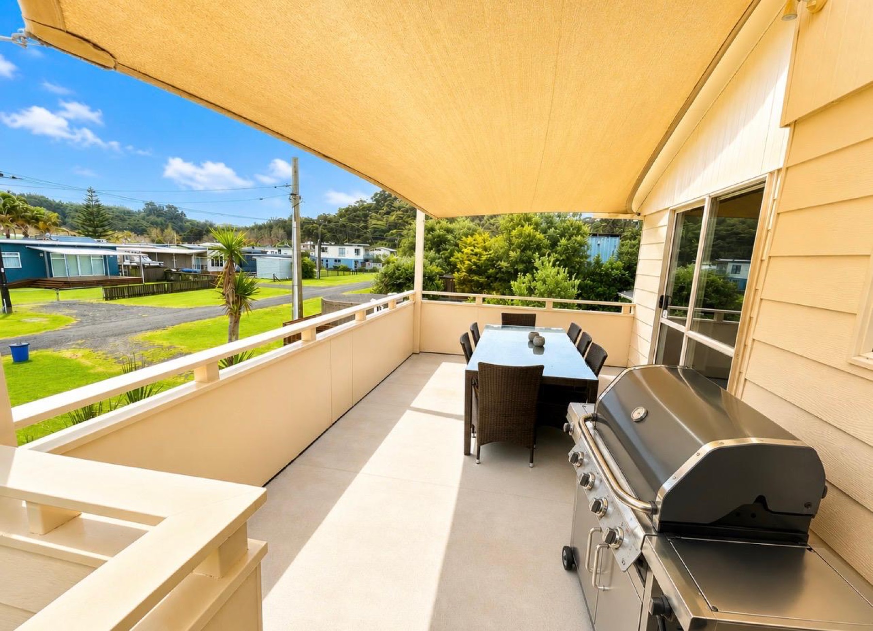 Barbecue and dining area on the sheltered upper deck
