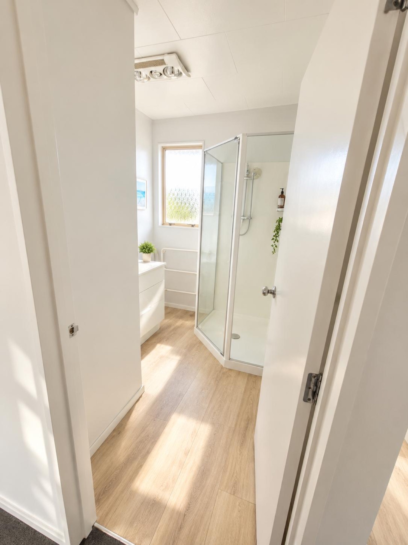 Upstairs bathroom with shower and vanity