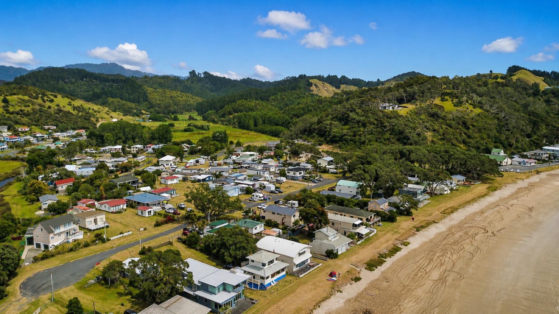 Aerial view of the Oakura Bay settlement beside the beach