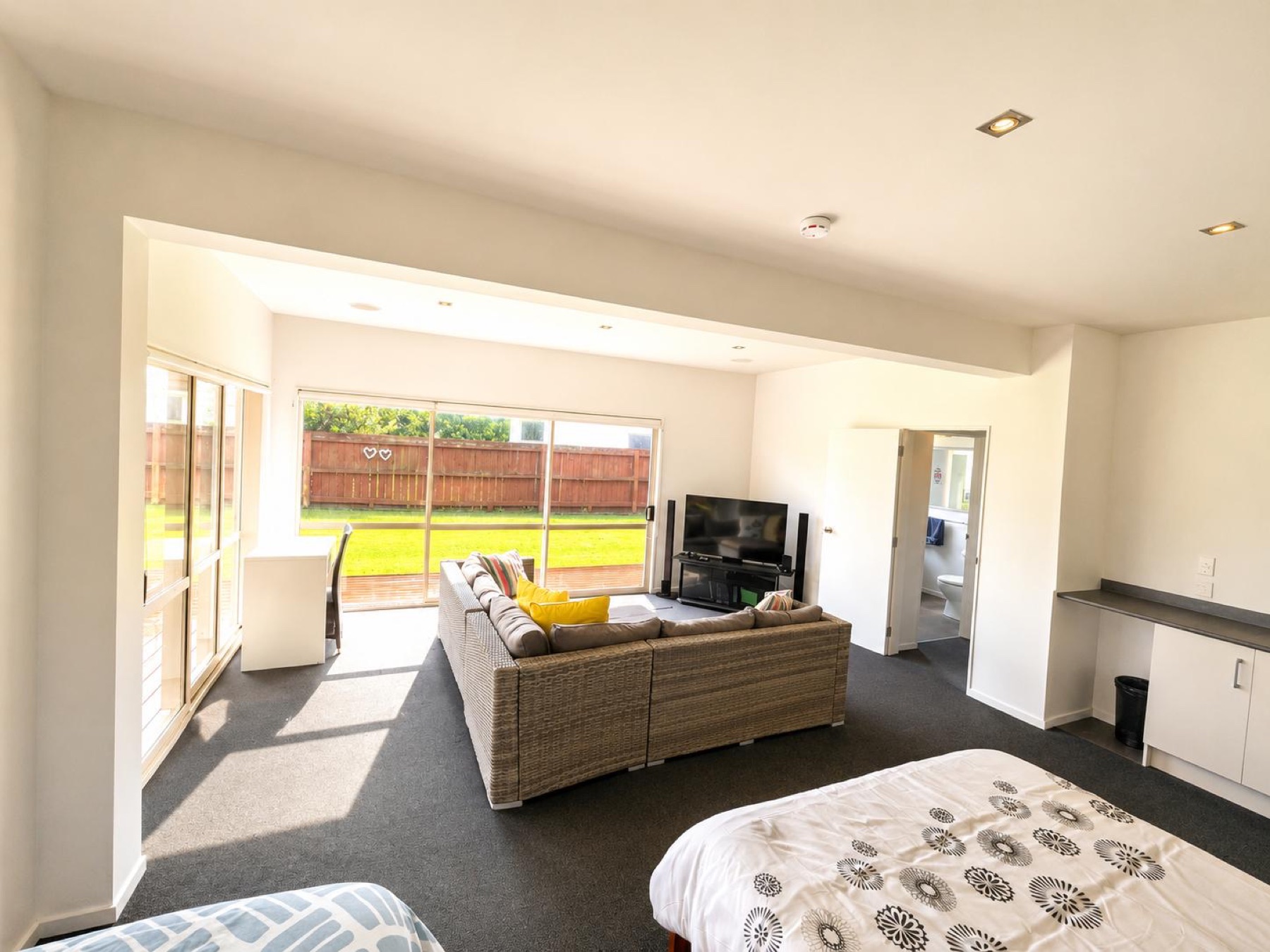 Spacious self-contained ground-floor guest zone opening to the lawn