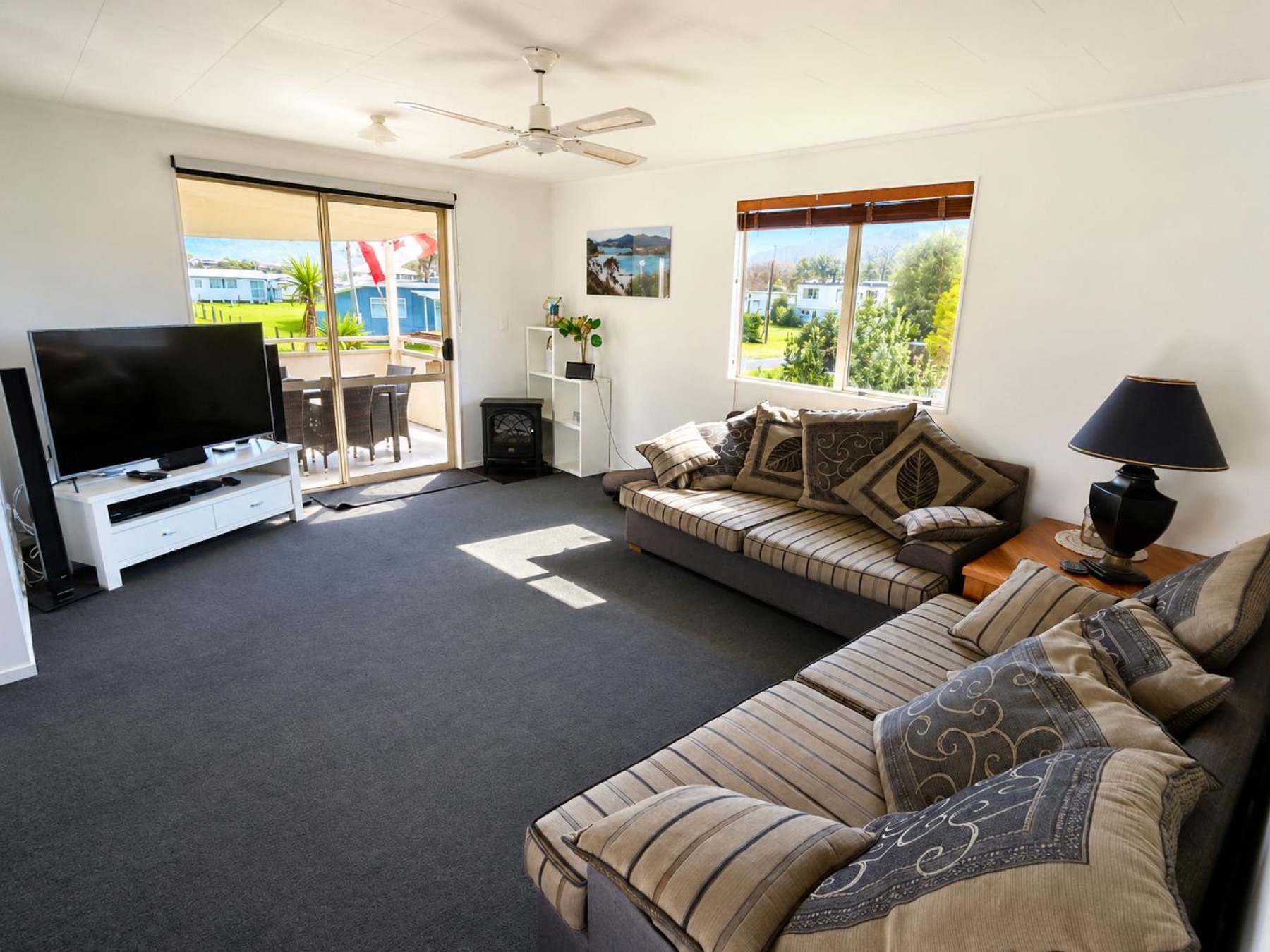 Bright upstairs lounge opening toward the covered balcony